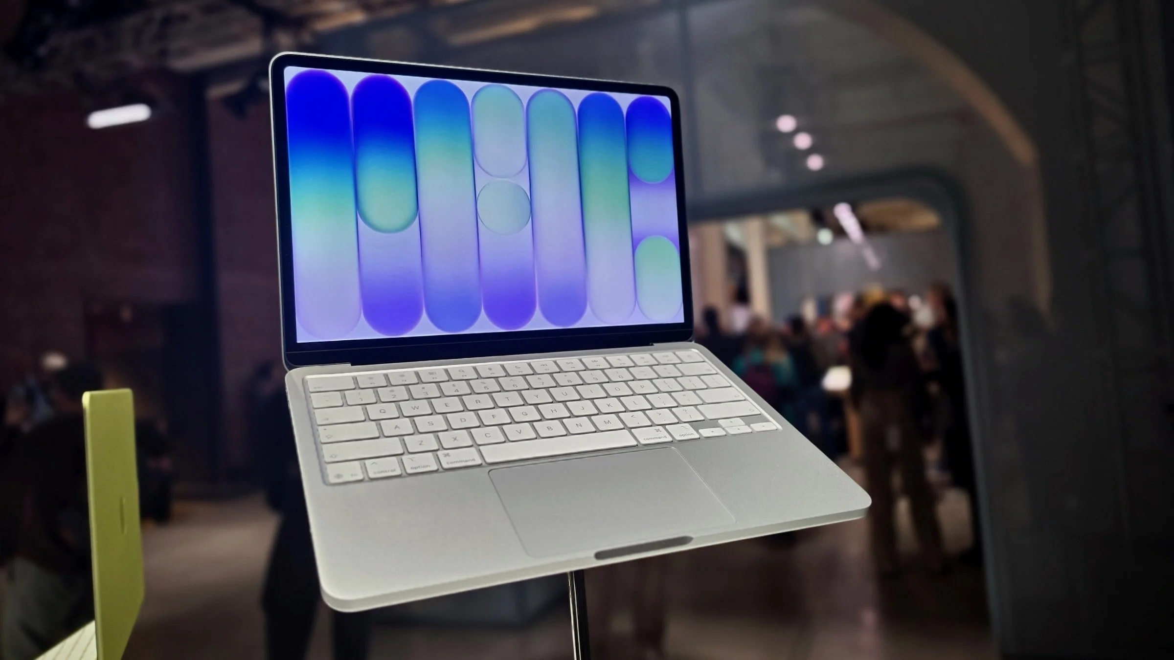 silver macbook neo on display at launch event